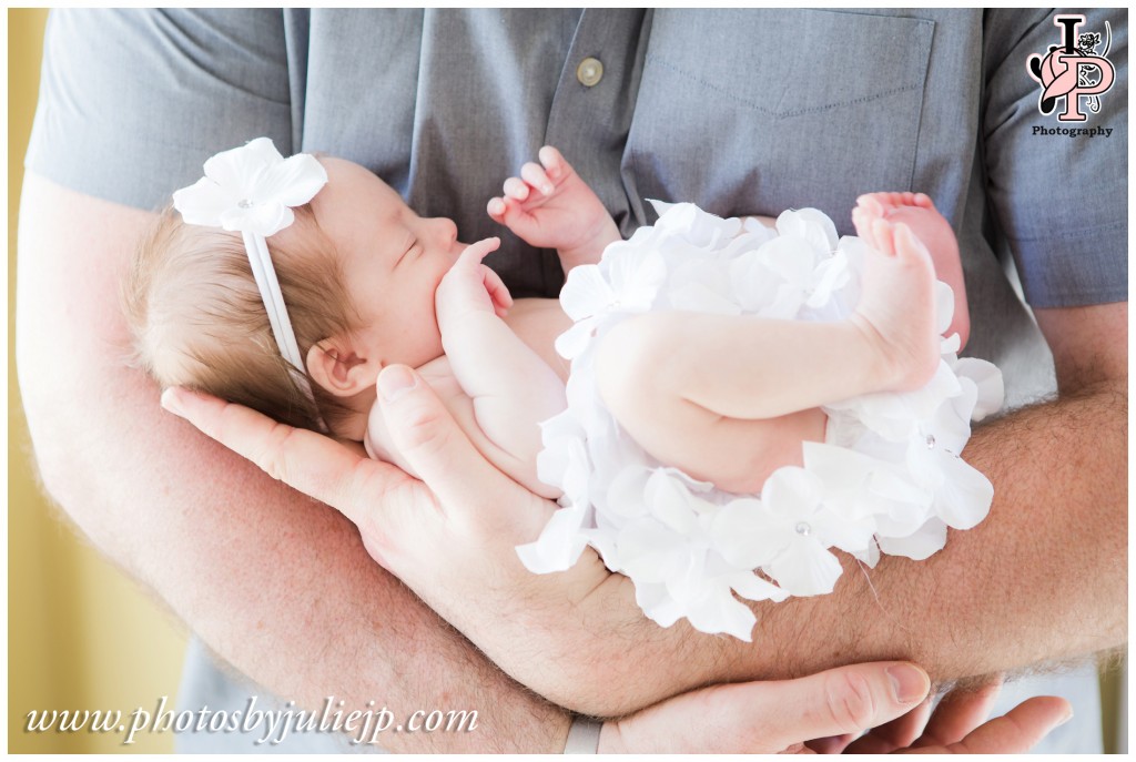 Daddy Holding Newborn Baby Girl