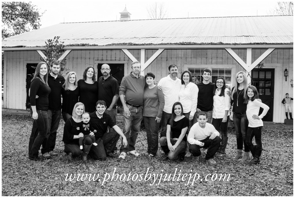 family portrait in front of barn